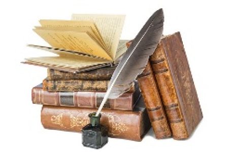 Pile of the old books and a quill in the inkwell isolated on a white background